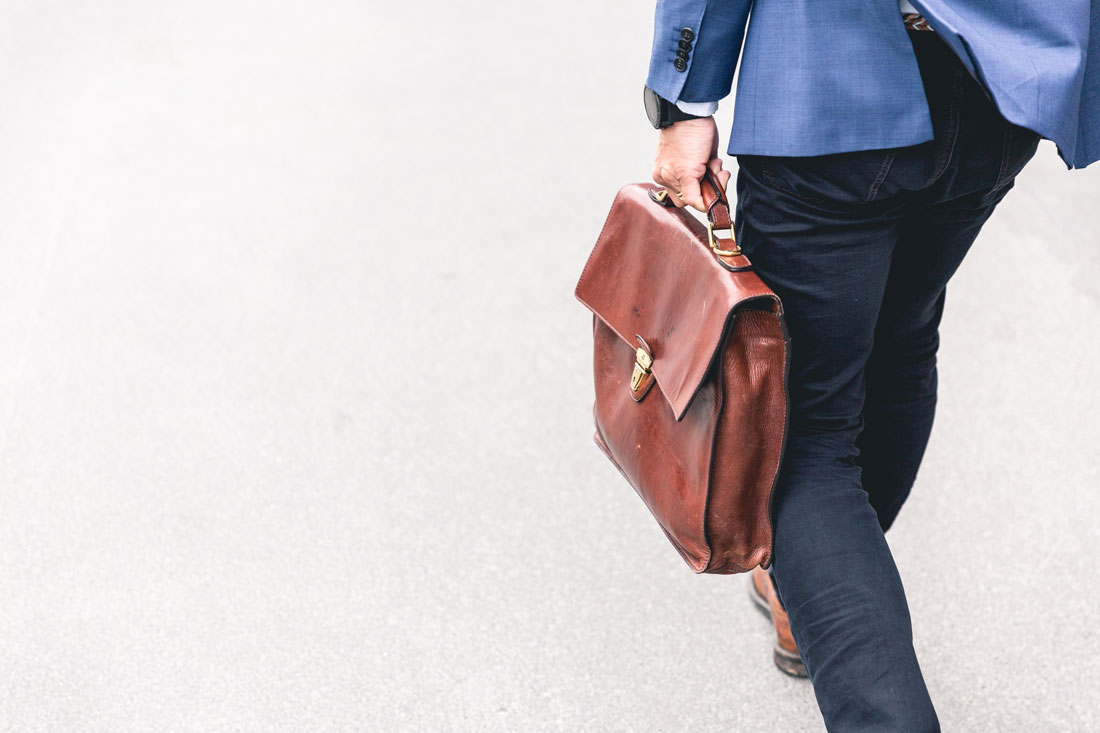 man walking with business bag