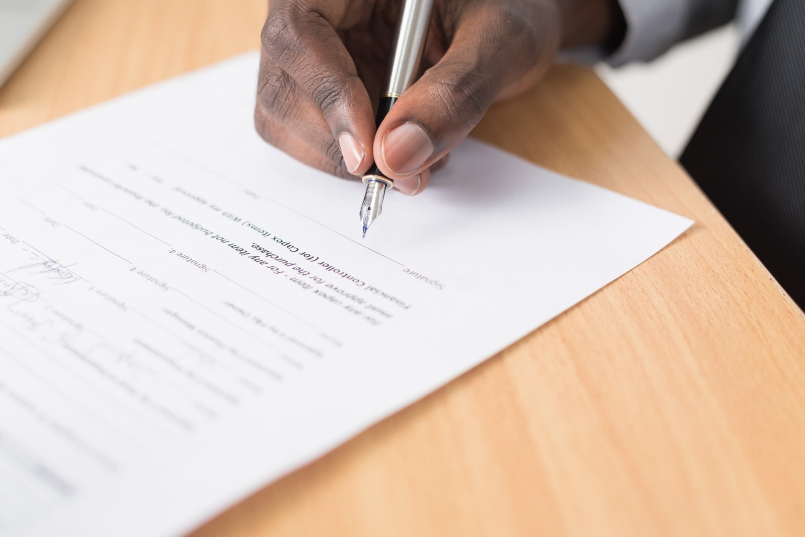 man signing document for new property
