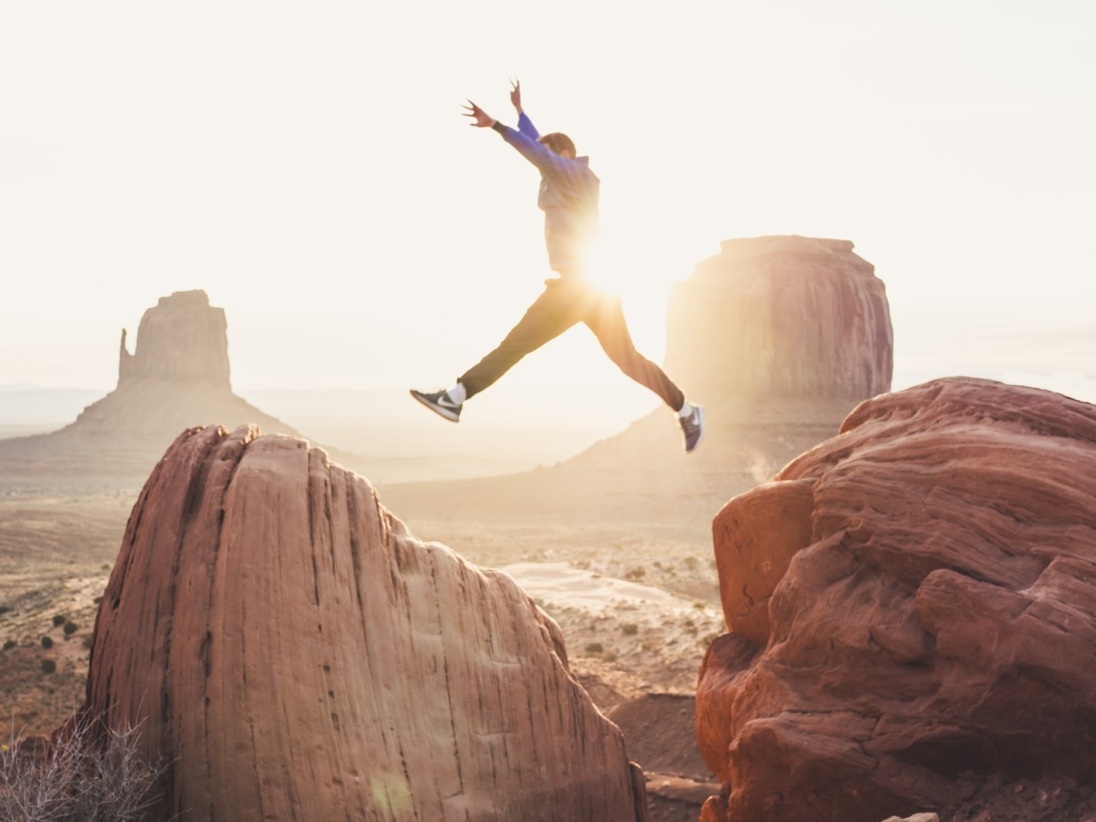 man jumping over rocks in Arizona